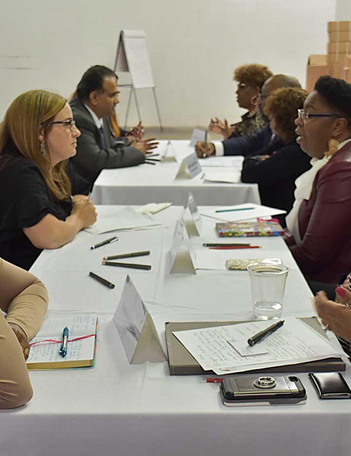 Diverse group of people at a table having a discussion
